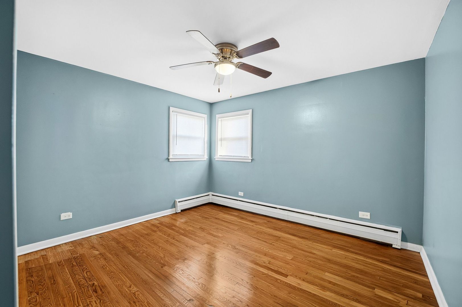9209 South State Street Chicago, IL 60619 - Photo 8 of 20 wooden floor in an empty room with a window