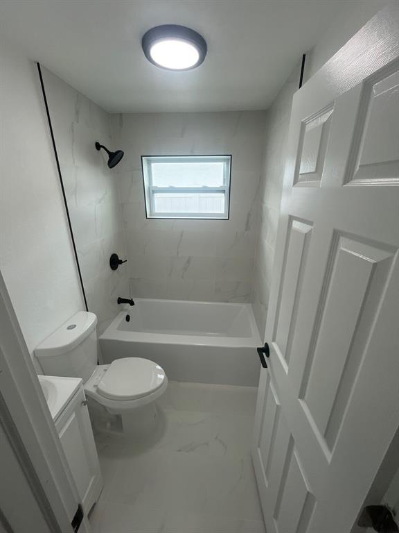 1457 West 31st Street, Unit 1 Riviera Beach, FL 33404 - Photo 11 of 16 a bathroom with a granite countertop sink toilet and shower
