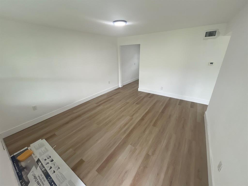 1457 West 31st Street, Unit 1 Riviera Beach, FL 33404 - Photo 3 of 16 a view of an empty room