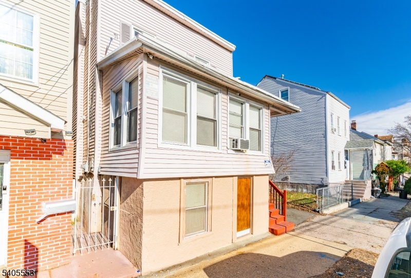 197 16th Avenue Paterson, NJ 07501 - Photo 3 of 23 a view of a house with a backyard