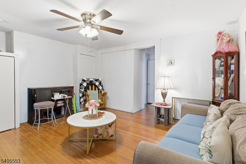 197 16th Avenue Paterson, NJ 07501 - Photo 4 of 23 a living room with furniture and a dining table