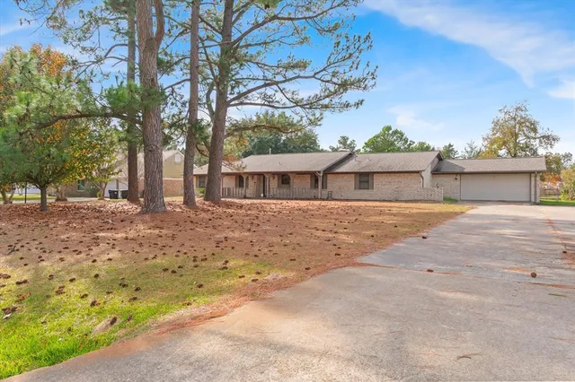 front view of a house with a dirt yard