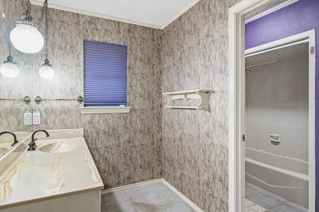 a view of a hallway with wooden cabinets