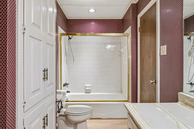 an empty room with a window and ceiling fan