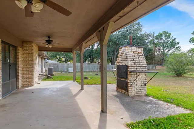 a backyard of a house with oven and garden