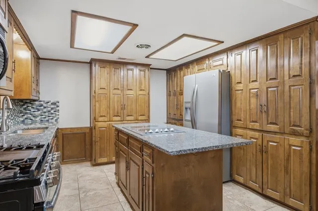 a kitchen that has a cabinets and a stove