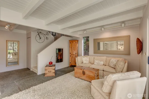 a living room with furniture and a window