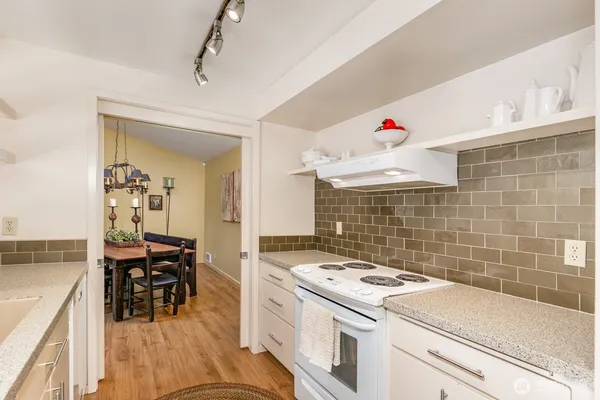 a kitchen with a sink and large window