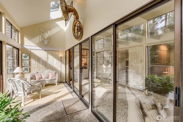 a very nice looking room with a large window and a chandelier