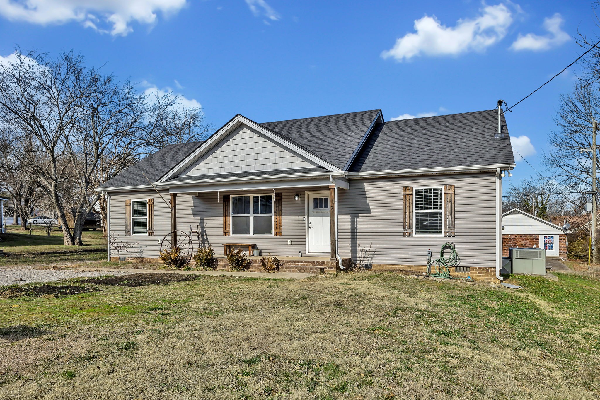 730 Cedar Street Lewisburg, TN 37091 - Photo 2 of 32 a front view of a house with garden