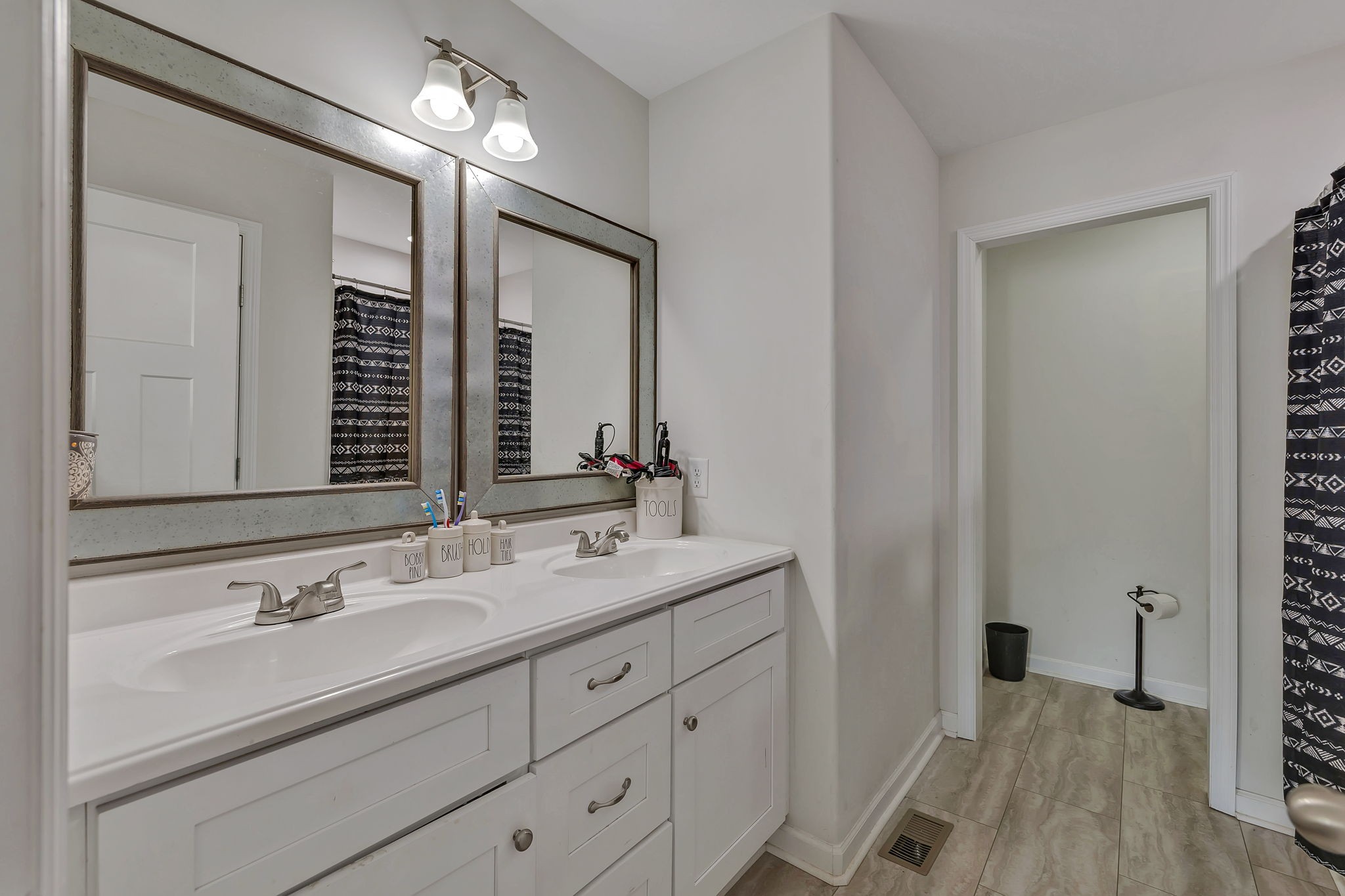 730 Cedar Street Lewisburg, TN 37091 - Photo 8 of 32 a bathroom with a double vanity sink and a mirror