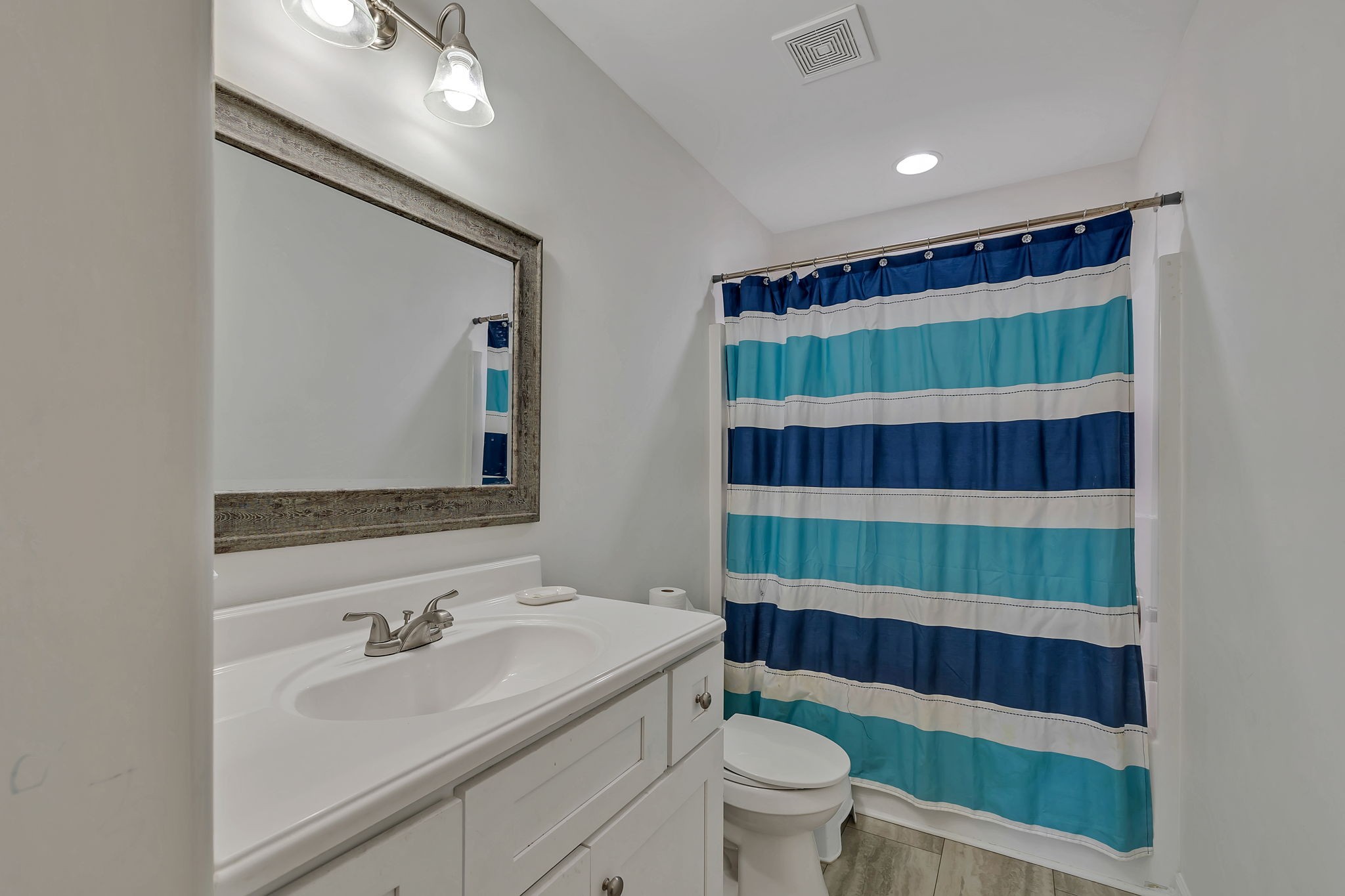 730 Cedar Street Lewisburg, TN 37091 - Photo 10 of 32 a bathroom with a sink a toilet and shower