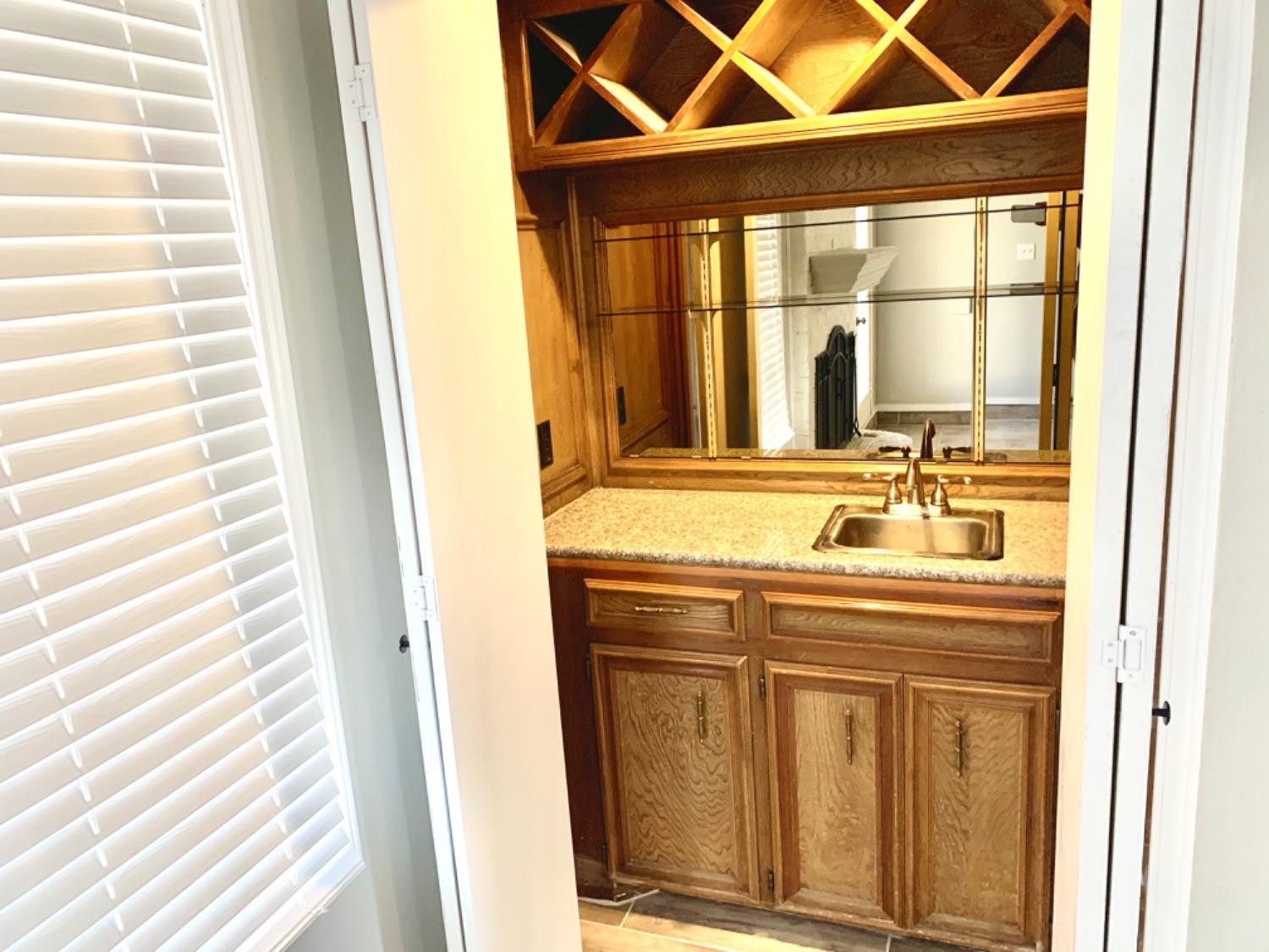 5708 91st Street Lubbock, TX 79424 - Photo 26 of 26 a bathroom with a sink and a window