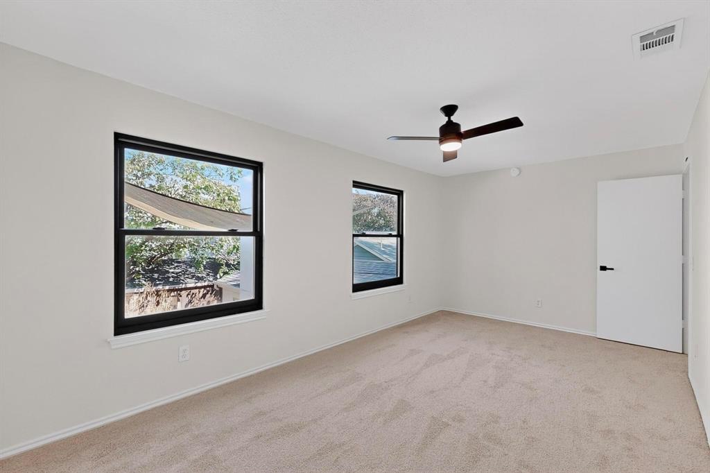 5009 Milam Street Dallas, TX 75206 - Photo 21 of 35 Spare room with light carpet and a ceiling fan