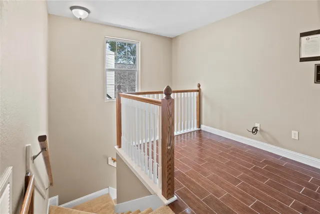 a spacious bathroom with a granite countertop sink mirror and double