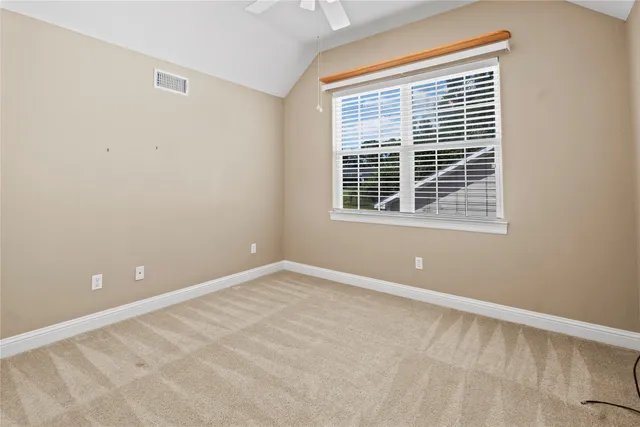 a view of room with window and door