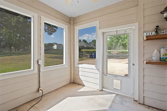 a view of a house with a backyard porch and sitting area