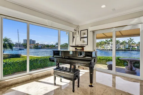 a view of a chairs and table in patio with a yard