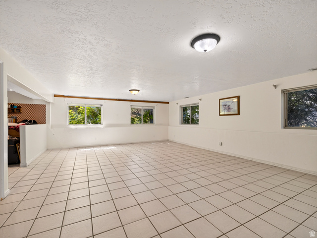 4380 Main Street Logan, UT 84321 - Photo 44 of 74 Tiled flooring, multiple windows, two flush-mount ceiling lights, and white wall finishes