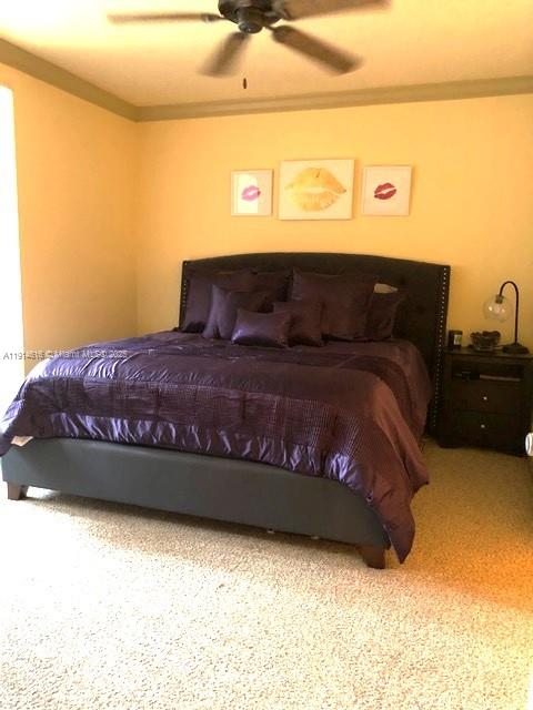 6584 West Sample Road, Unit 6584 Coral Springs, FL 33067 - Photo 7 of 13 a view of a bed in a bedroom