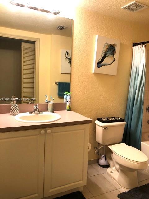 6584 West Sample Road, Unit 6584 Coral Springs, FL 33067 - Photo 10 of 13 a bathroom with a sink mirror vanity and toilet