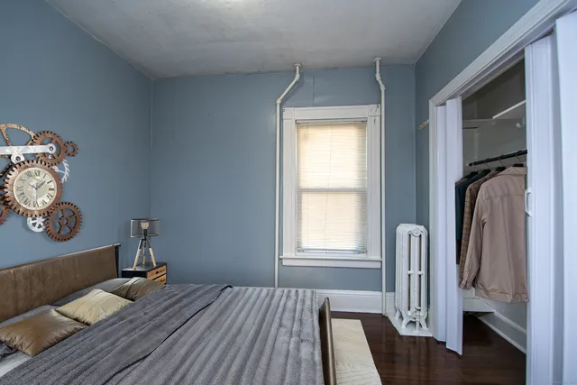 a room with wooden floor and a window