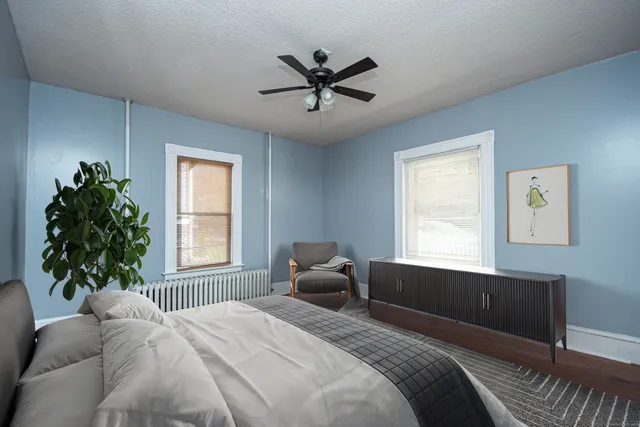 a bedroom with a bed and a window