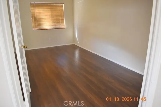 an empty room with wooden floor