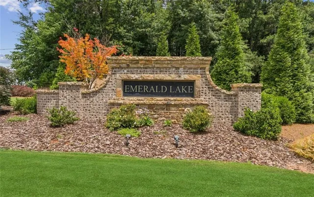 a view of a swimming pool with a patio and a yard