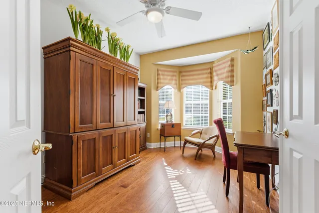a kitchen with appliances a refrigerator and cabinets