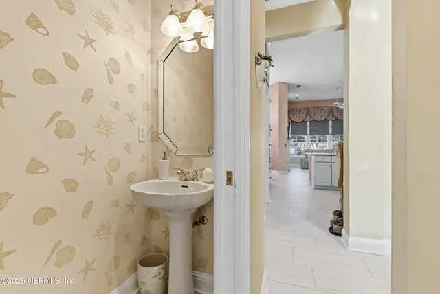 a spacious bathroom with a granite countertop tub sink shower and mirror