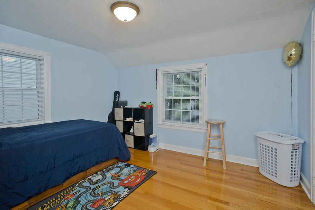 46 Thames Street Springfield, MA 01104 - Photo 8 of 12 a bedroom with furniture and a window
