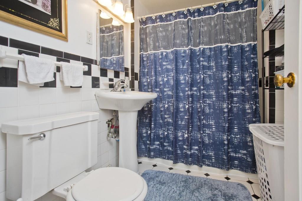 46 Thames Street Springfield, MA 01104 - Photo 10 of 12 a bathroom with a sink toilet and shower