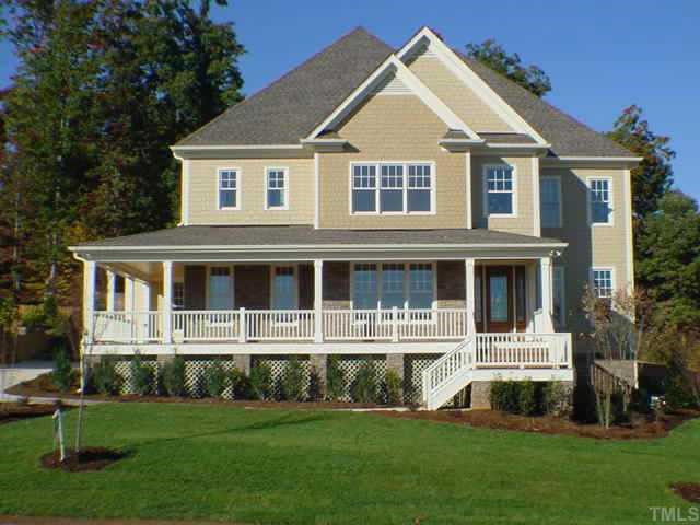 Inviting front door entry with classic 8' door cut glass details! Front and side porches more than rocking chair deep-an outside living space that will be enjoyed much of the year! Seperate side entrance from the drive for family entrance. Exterior Front