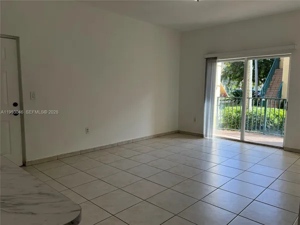 an empty room with sliding door