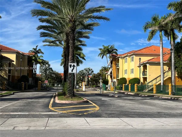 a building with palm trees in front of it