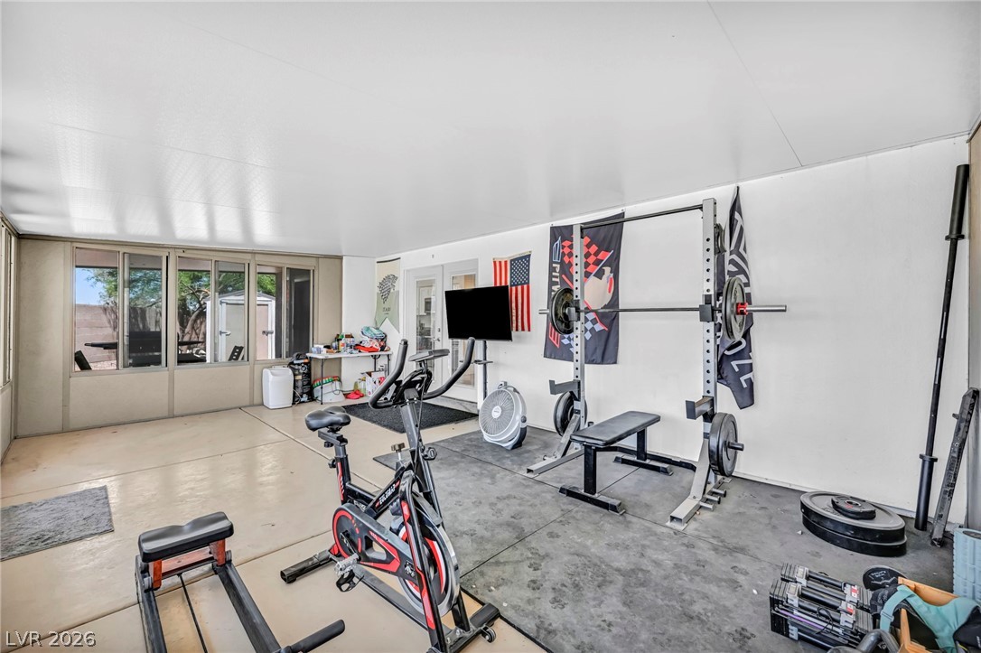 1234 Sunfire Street Henderson, NV 89014 - Photo 23 of 40 An ideal space for fitness enthusiasts, this room offers dedicated areas for diverse workouts.