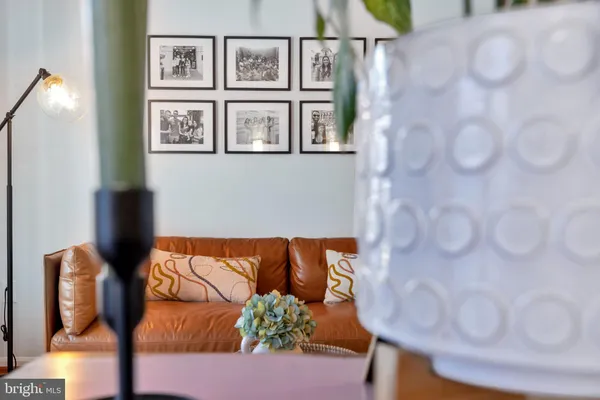 a blue couch sitting next to a white wall