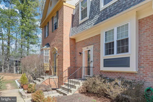 a view of a brick house many windows