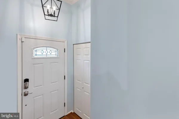 a view of an entryway with wooden floor