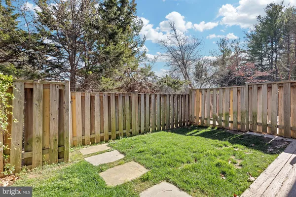 a garden with wooden fence