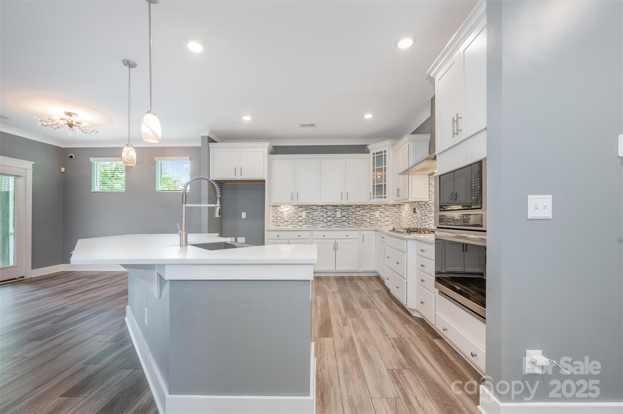 651-r L R L Stowe Road Belmont, NC 28012 - Photo 14 of 35 a kitchen with kitchen island a sink stainless steel appliances and cabinets