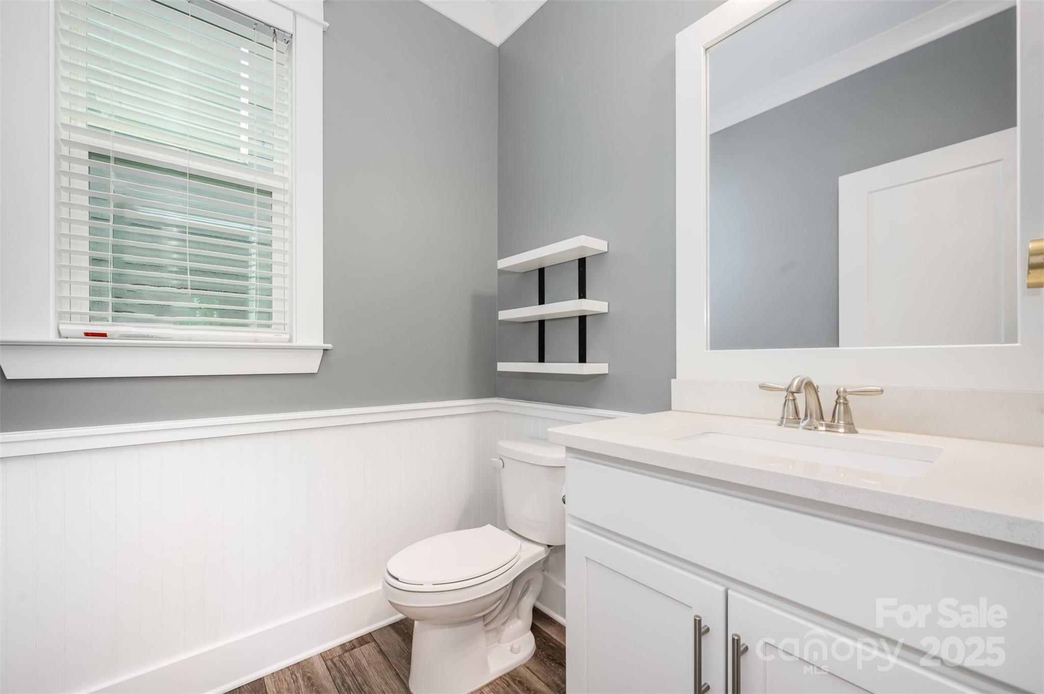 651-r L R L Stowe Road Belmont, NC 28012 - Photo 17 of 35 a bathroom with a sink a toilet and vanity