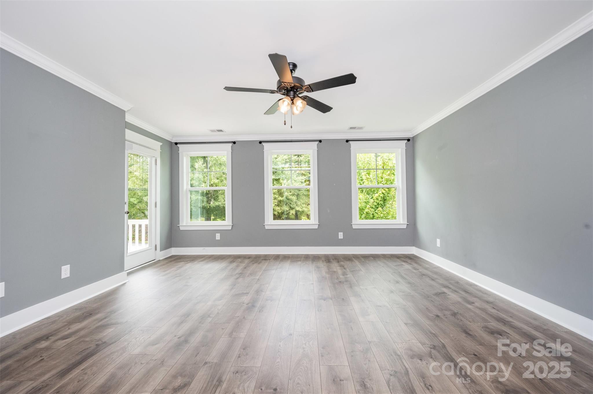651-r L R L Stowe Road Belmont, NC 28012 - Photo 21 of 35 a view of an empty room with wooden floor and a window