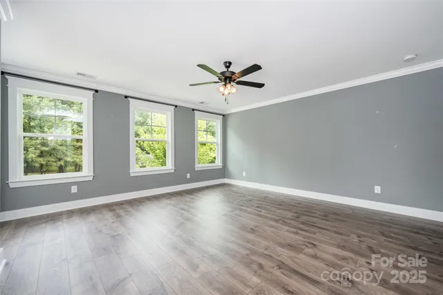 a bedroom with a large bed and a couch