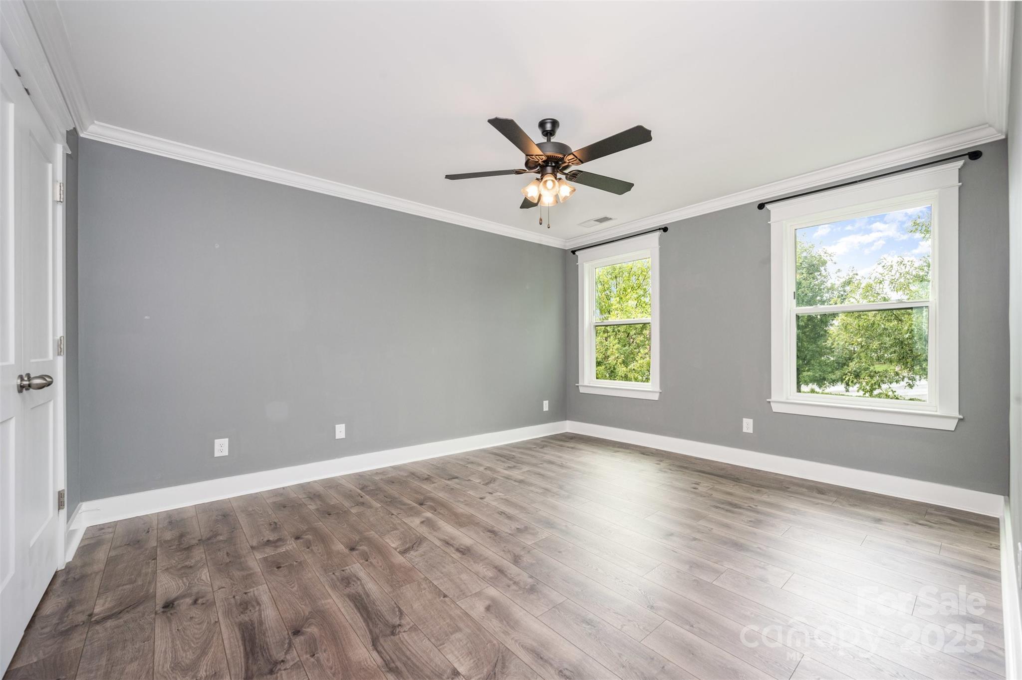 651-r L R L Stowe Road Belmont, NC 28012 - Photo 28 of 35 a view of an empty room with a window and wooden floor