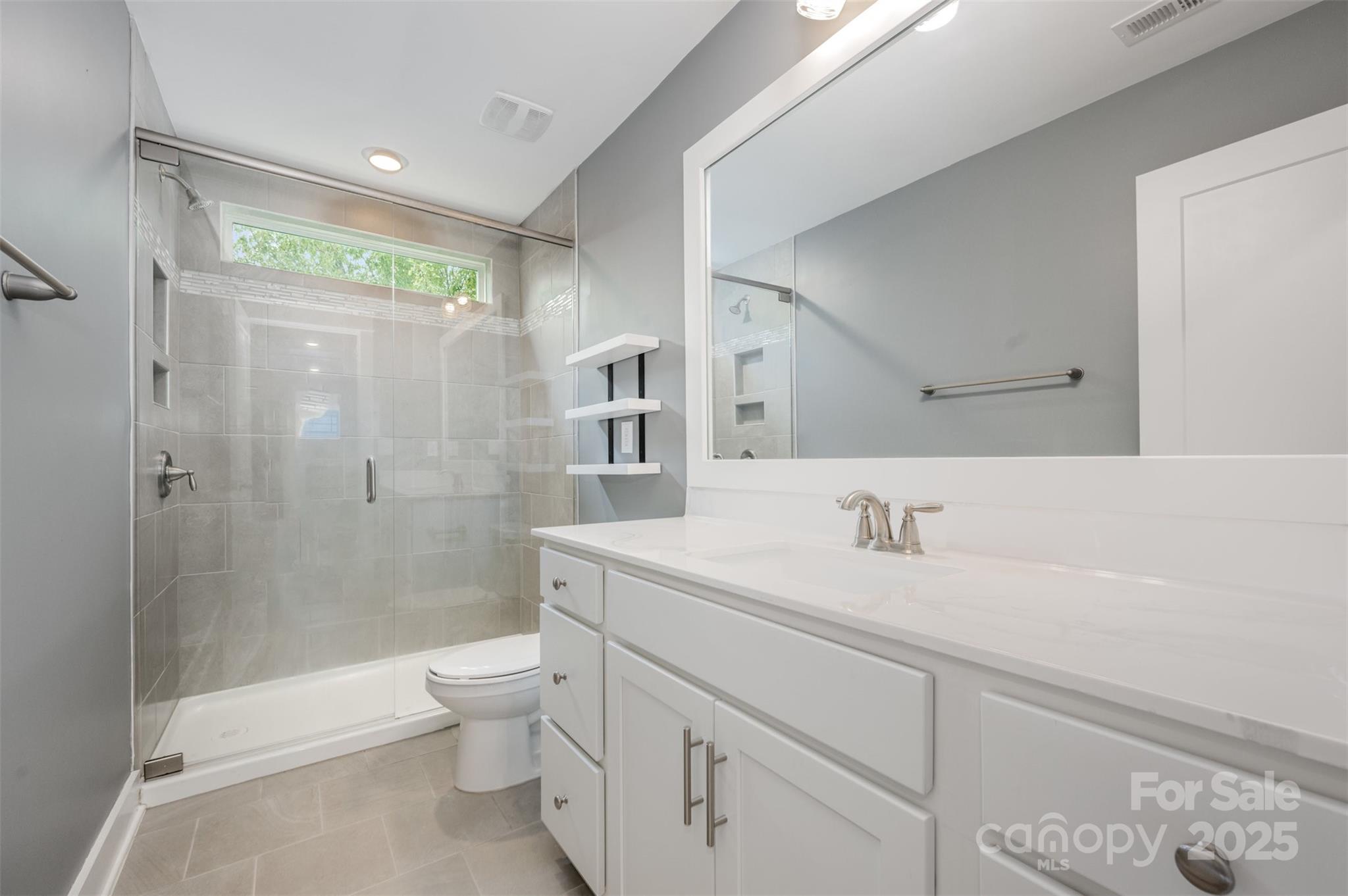 651-r L R L Stowe Road Belmont, NC 28012 - Photo 29 of 35 a bathroom with a sink a toilet and shower