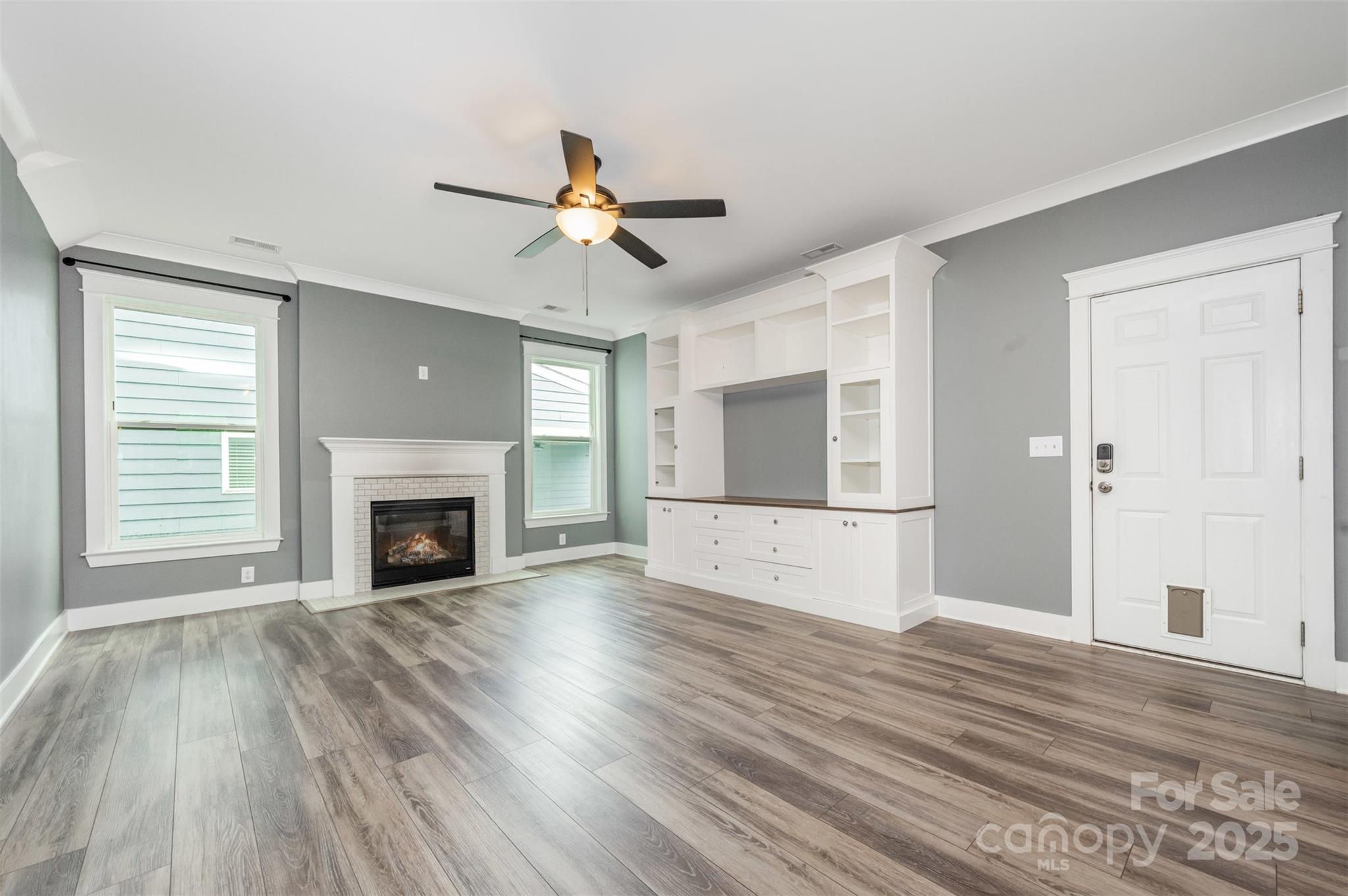 651-r L R L Stowe Road Belmont, NC 28012 - Photo 8 of 35 a view of empty room with wooden floor and fireplace