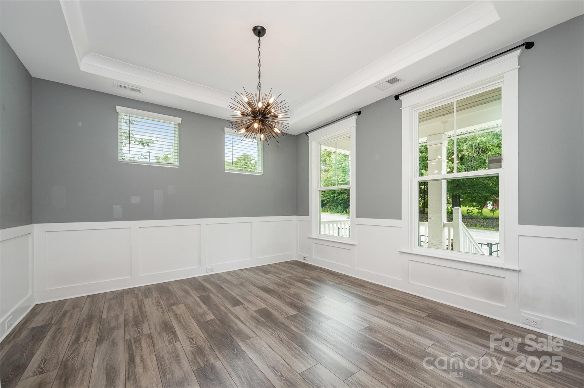 651-r L R L Stowe Road Belmont, NC 28012 - Photo 9 of 35 a view of an empty room with wooden floor and a window