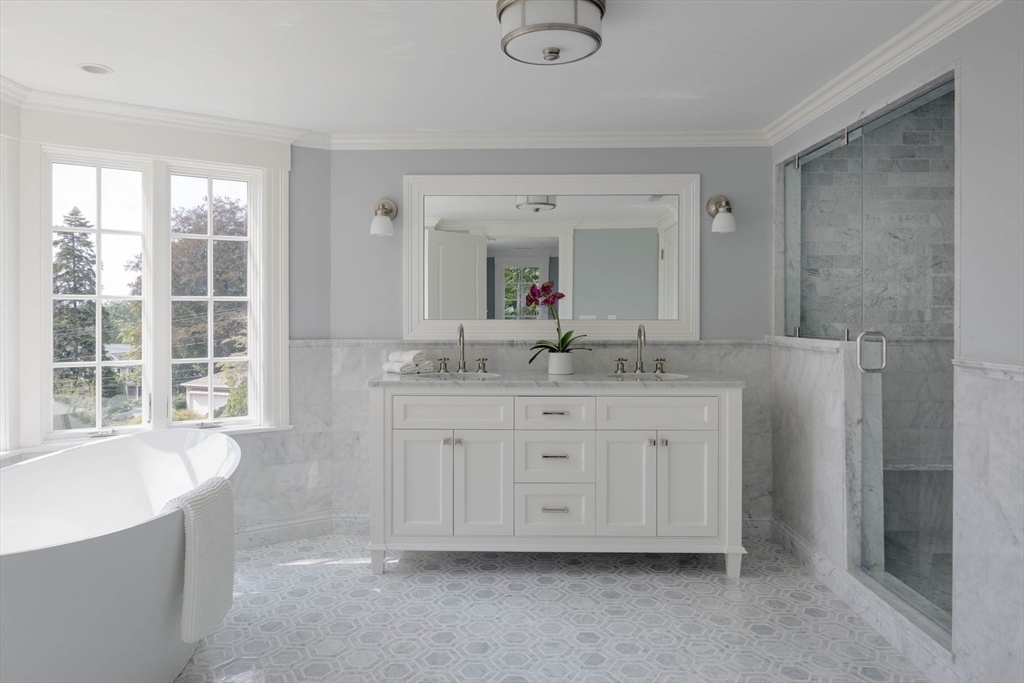 1 Adams Street Lexington, MA 02420 - Photo 13 of 20 a bathroom with a granite countertop sink mirror and bathtub